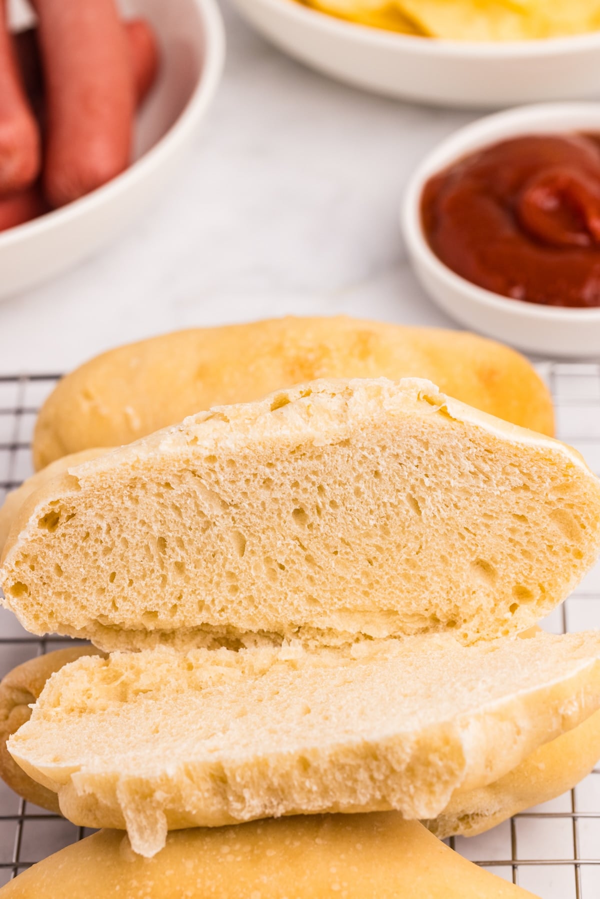A homemade hot dog bun sliced in half.